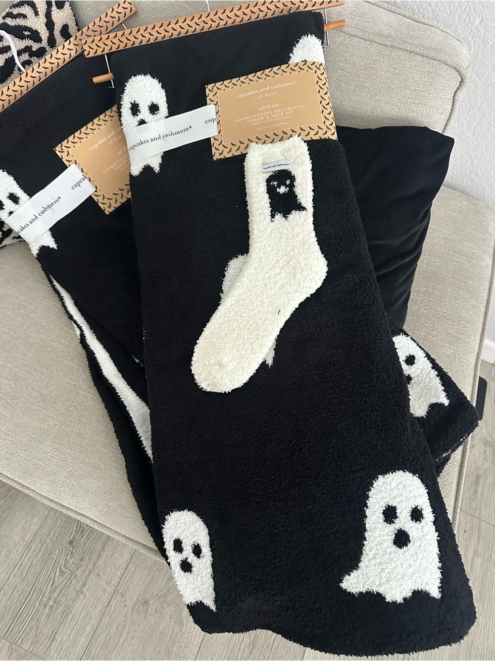 cupcakes & cashmere Black Throw Blanket with White Ghost Motif